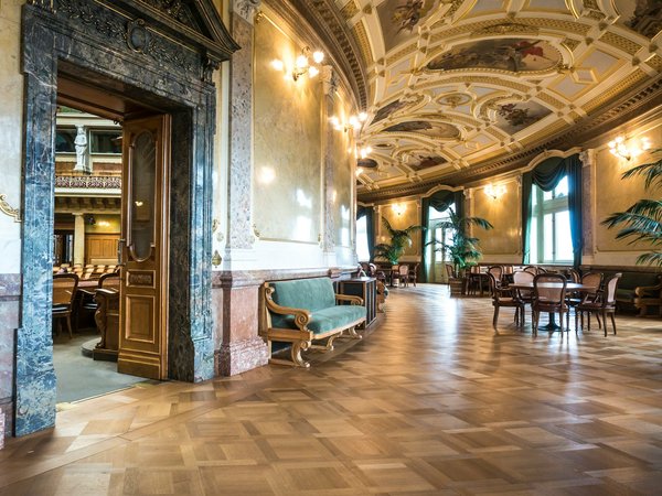 What is the best way to display art in a UK home with high ceilings?