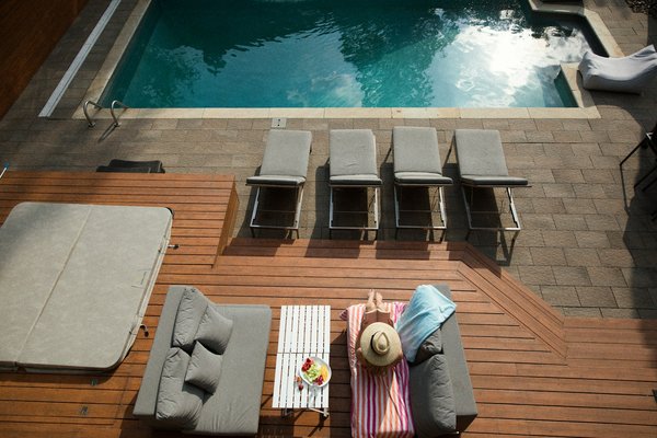 What are the effective ways to strip and reseal pool decking in UK homes?